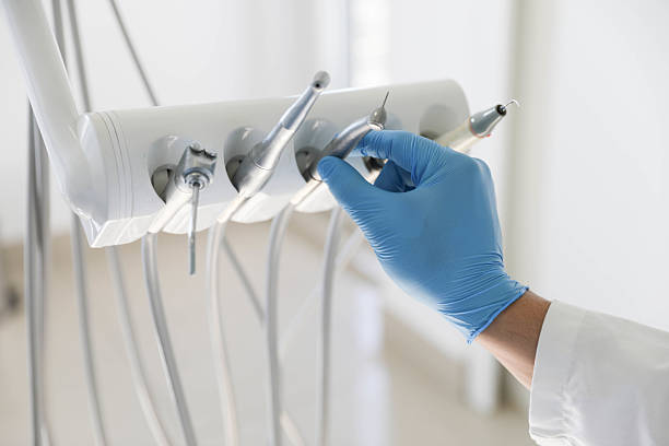 Professional Tooth Extraction technician working in Oak Hill, FL